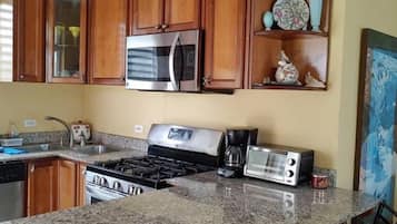Fridge, coffee/tea maker, cookware/dishes/utensils