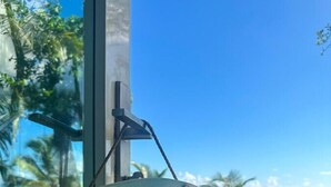 A sign with the words "RELAX LIFE IS GOOD" hanging on a post. - Luquillo Beachfront Villa with Ocean Views & Room to Relax (Luquillo)