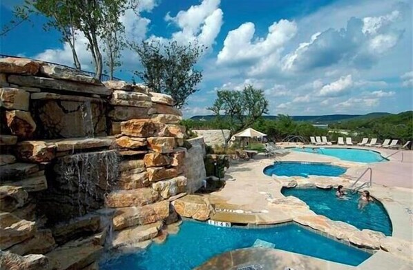 Relax by the resort's pools surrounded by natural rock formations and lush greenery.