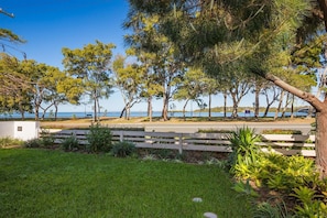 Surrounded by lush trees and a well-manicured lawn, this property offers a serene escape.