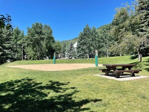 Escape to a serene park setting surrounded by lush greenery and rolling hills, perfect for relaxation and outdoor activities.