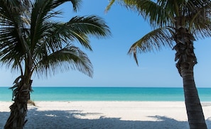 A beach with white sand and clear turquoise water. - 4 bedroom lakefront home<br>With heated pool (Englewood)