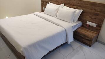 Deluxe Room, 1 Queen Bed, Pool View | 1 bedroom, individually furnished, soundproofing, iron/ironing board