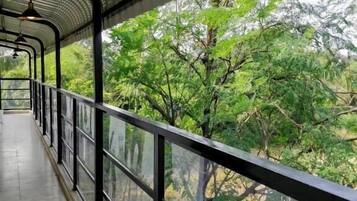 Deluxe Room, 1 Queen Bed, Pool View | Balcony