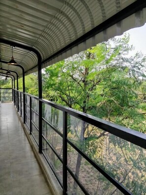 Deluxe Room, 1 Queen Bed, Pool View | Balcony
