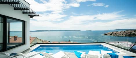 Outdoor pool, a heated pool, pool loungers