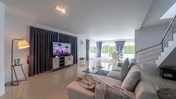 Family Villa | Living area | Flat-screen TV