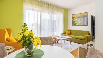 Apartment, 1 Bedroom | Living area | 125-cm Smart TV with cable channels