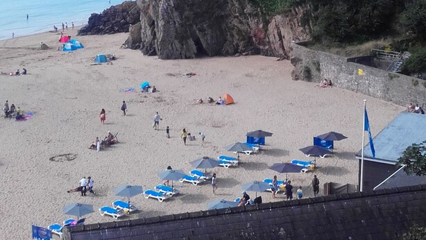 A coastal hotel with a cliffside location, beach access, and a view of the sea.