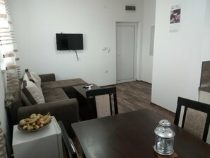 Standard Apartment, Mountainside | Living area | Flat-screen TV