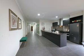 House (9 Bedrooms) | Private kitchen | Full-size fridge, microwave, oven, stovetop