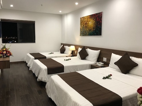 Family Room, Multiple Beds, Balcony, City View | Minibar, soundproofing, free WiFi, bed sheets. Windy Hotel Quang Binh