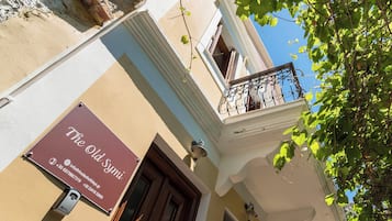 A building facade with a sign reading 'The Old Synagogue' and a mailbox.