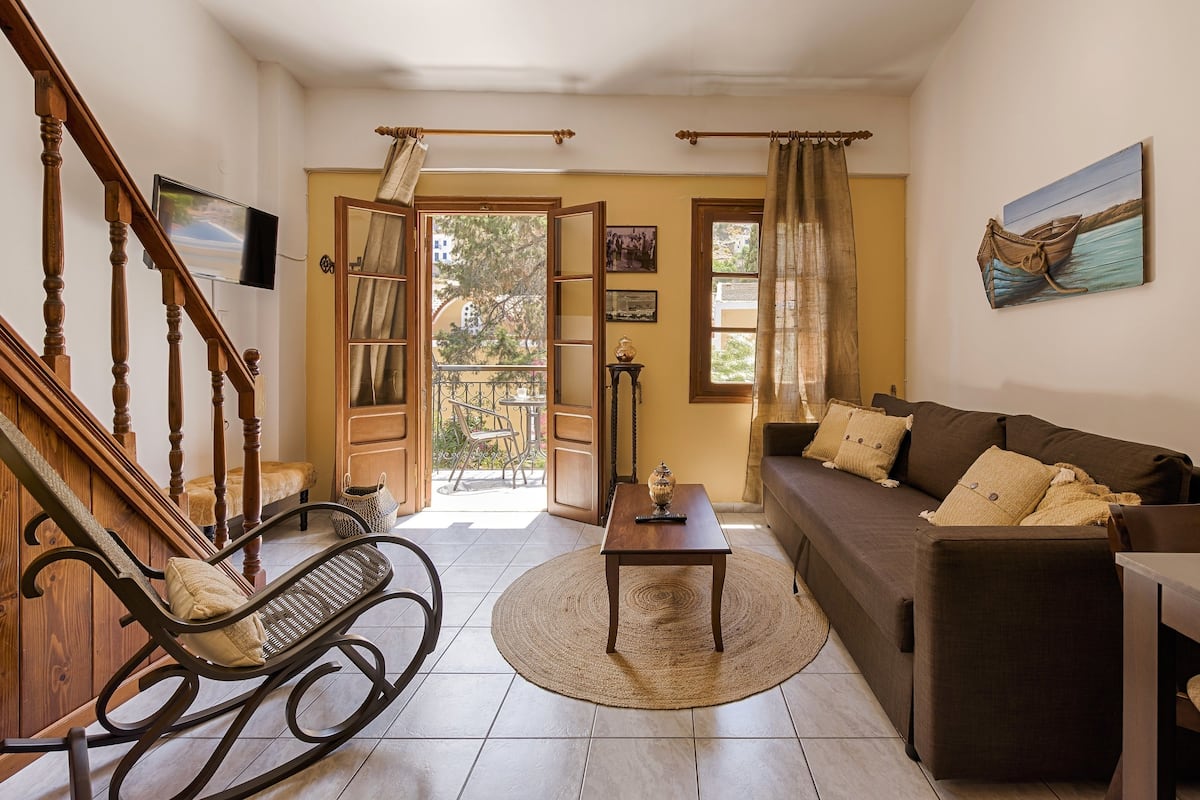 Apartment, Garden View | Living area | Flat-screen TV