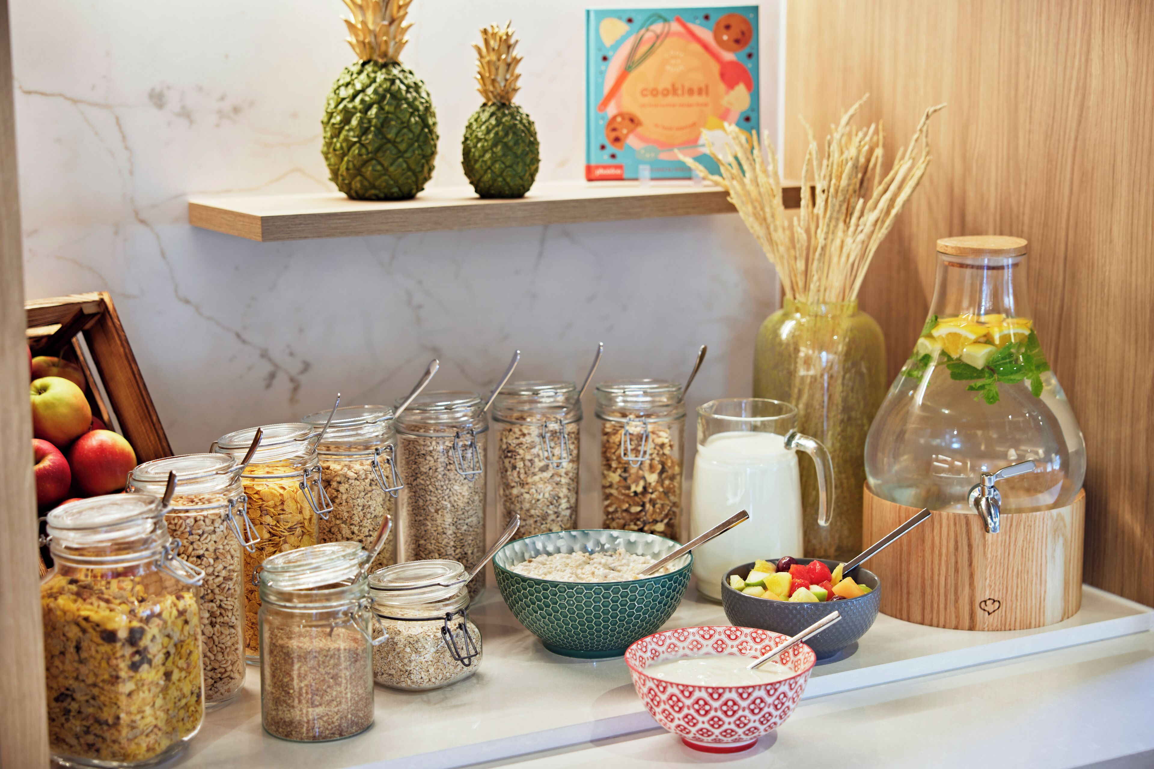 A breakfast buffet with various food items and containers.