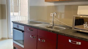 Apartemen Kota, 4 kamar tidur (Kennedy) | Dapur pribadi | Lemari es besar, microwave, oven, dan kompor