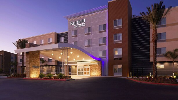 A Fairfield by Marriott Inn & Suites building with a modern design, featuring a prominent entrance with a covered walkway and a stone facade. - Fairfield Inn & Suites by Marriott Riverside Moreno Valley (Moreno Valley)