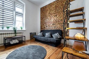 Business-Vierbettzimmer | Wohnbereich