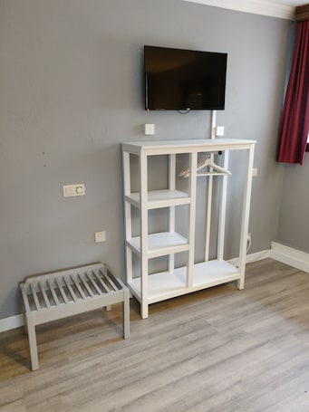 Desk, laptop workspace, blackout drapes, iron/ironing board