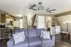 Relax in this stylish living space with a comfortable sofa, coffee table, and floor lamp.