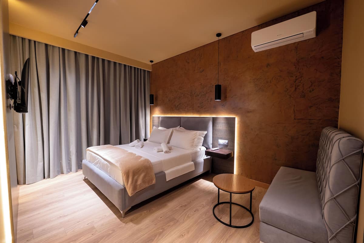 Deluxe Quadruple Room, Sea View | Premium bedding, down comforters, memory foam beds, minibar