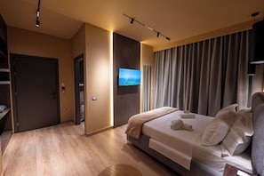 Chambre quadruple Deluxe, vue sur la mer | Literie de qualité, couette en duvet