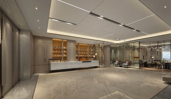 A modern reception area with a marble floor, a reception desk, and a seating area with tables and chairs. - Holiday Inn Express Changzhou Xinbei by IHG (Changzhou)