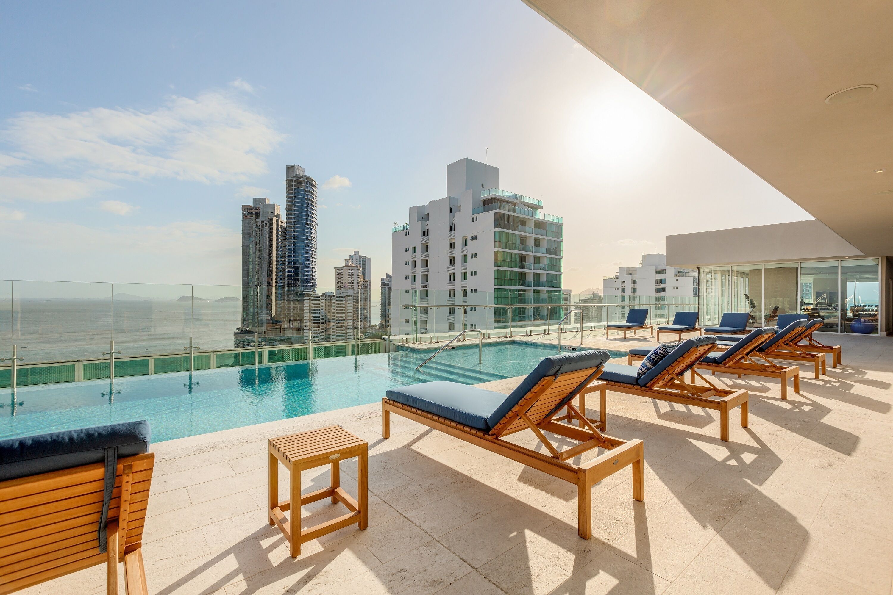 outdoor pool, open 6:00 am to 11:00 pm, pool umbrellas, pool loungers