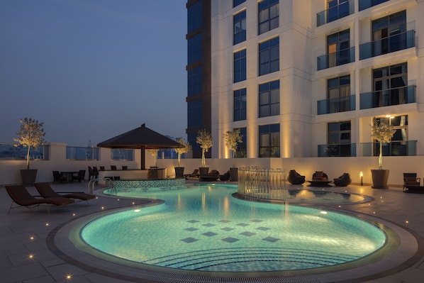 Outdoor pool, open 8:00 AM to 8:00 PM, pool umbrellas, pool loungers