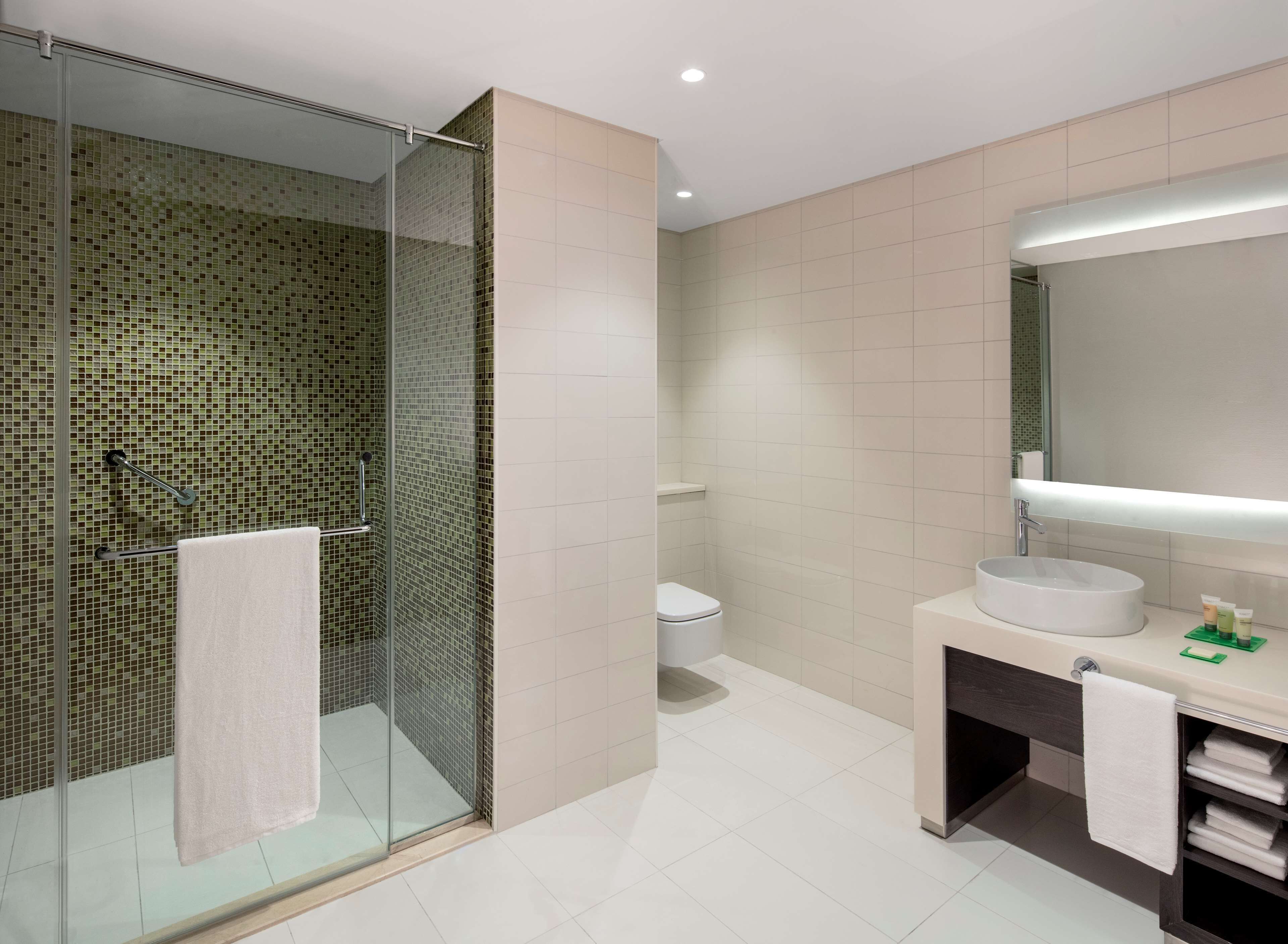 suite, 1 king bed with sofa bed | bathroom | hydromassage showerhead, free toiletries, hair dryer, bathrobes