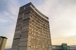 A tall hotel with a modern design, featuring a prominent 'Fiesta Americana' sign on the top. - Fiesta Americana San Luis Potosi (San Luis Potosi)