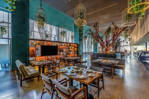 Breakfast, lunch, dinner served; local and international cuisine 