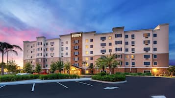 Hotel features a modern architectural design with a prominent entrance and well-maintained grounds.