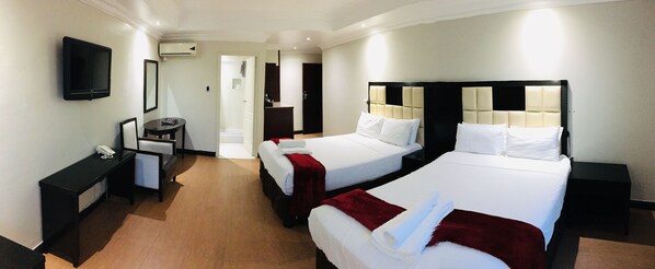 Family Room | In-room safe, desk, laptop workspace, blackout curtains - Al Hamra Hotel (Durban)