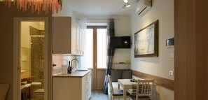 Prémium szoba | Nappalirész | Síkképernyős tévé