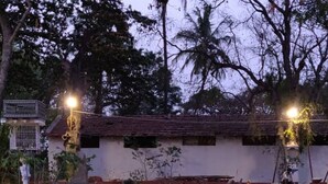 A rustic building with a tiled roof, surrounded by large rocks and sparse vegetation. - Kimberly By Jade (Kunigal)