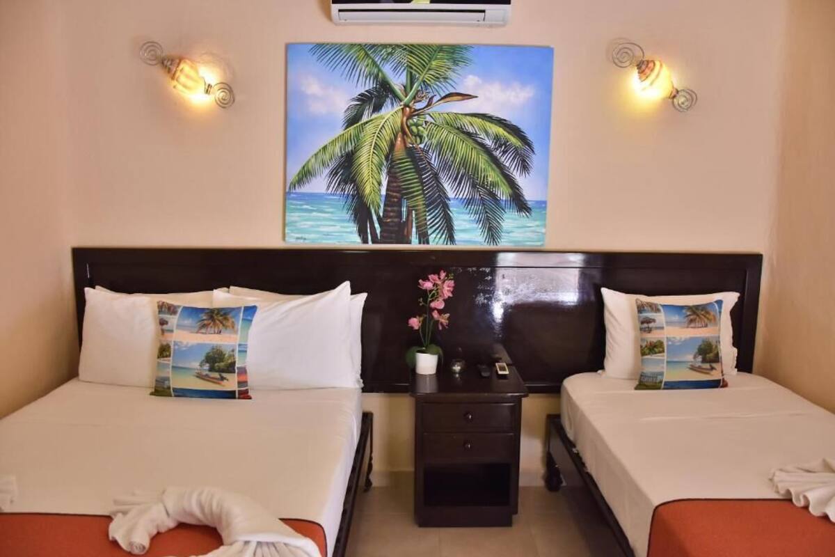 Habitación triple estándar | Caja fuerte, wifi gratis, ropa de cama