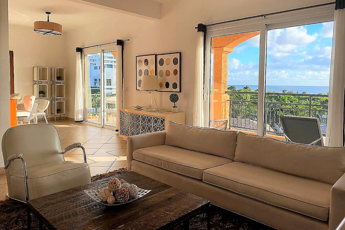 Deluxe Apartment, 3 Bedrooms, Sea View | Living room | Flat-screen TV