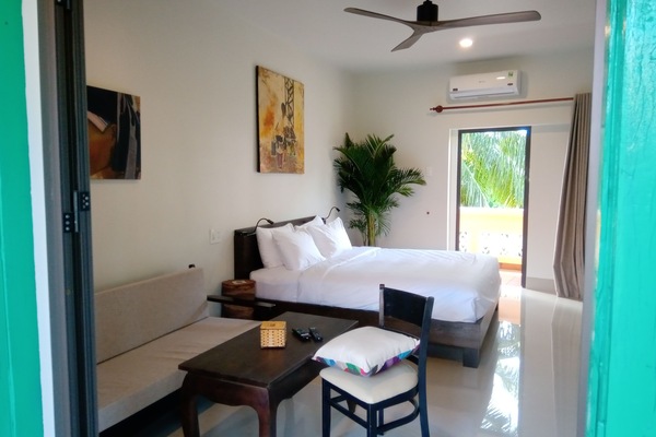 Exclusive Quadruple Room (Not Too Fast) | Minibar, in-room safe, desk, laptop workspace