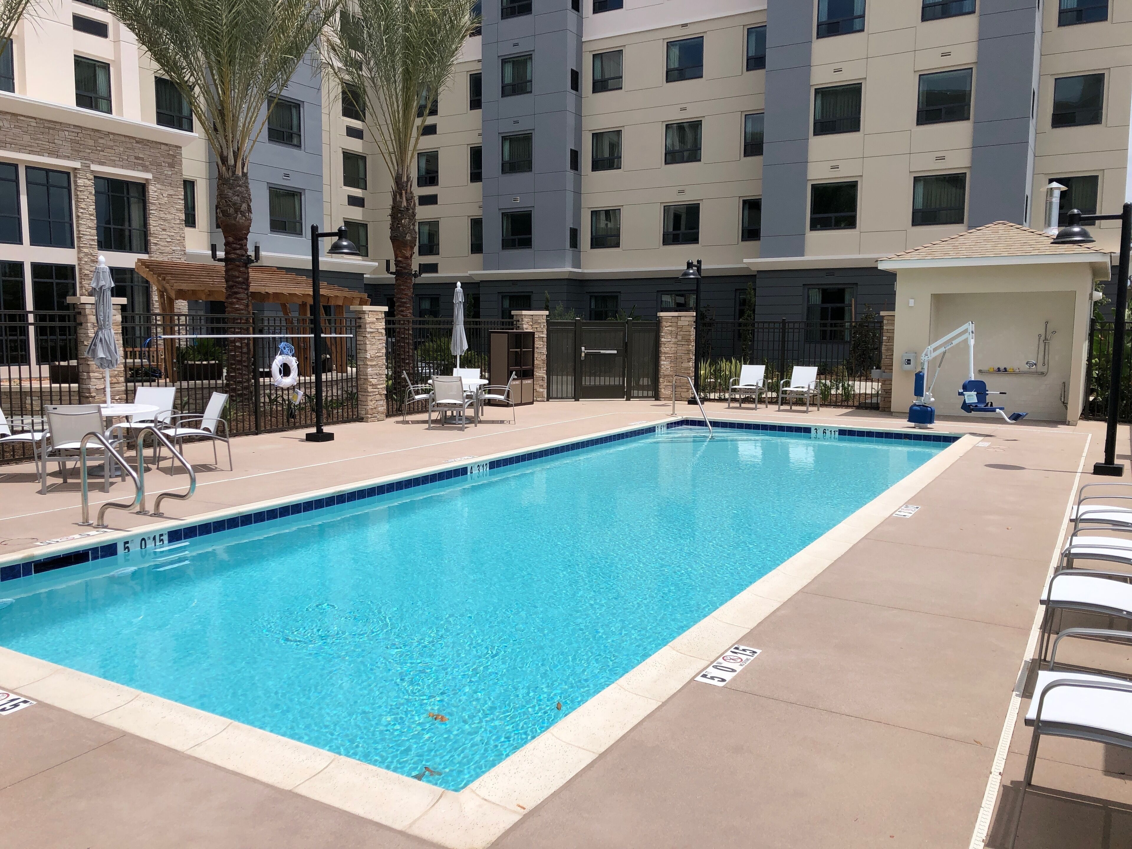 outdoor pool, open 8:00 am to 10:00 pm, pool umbrellas, pool loungers