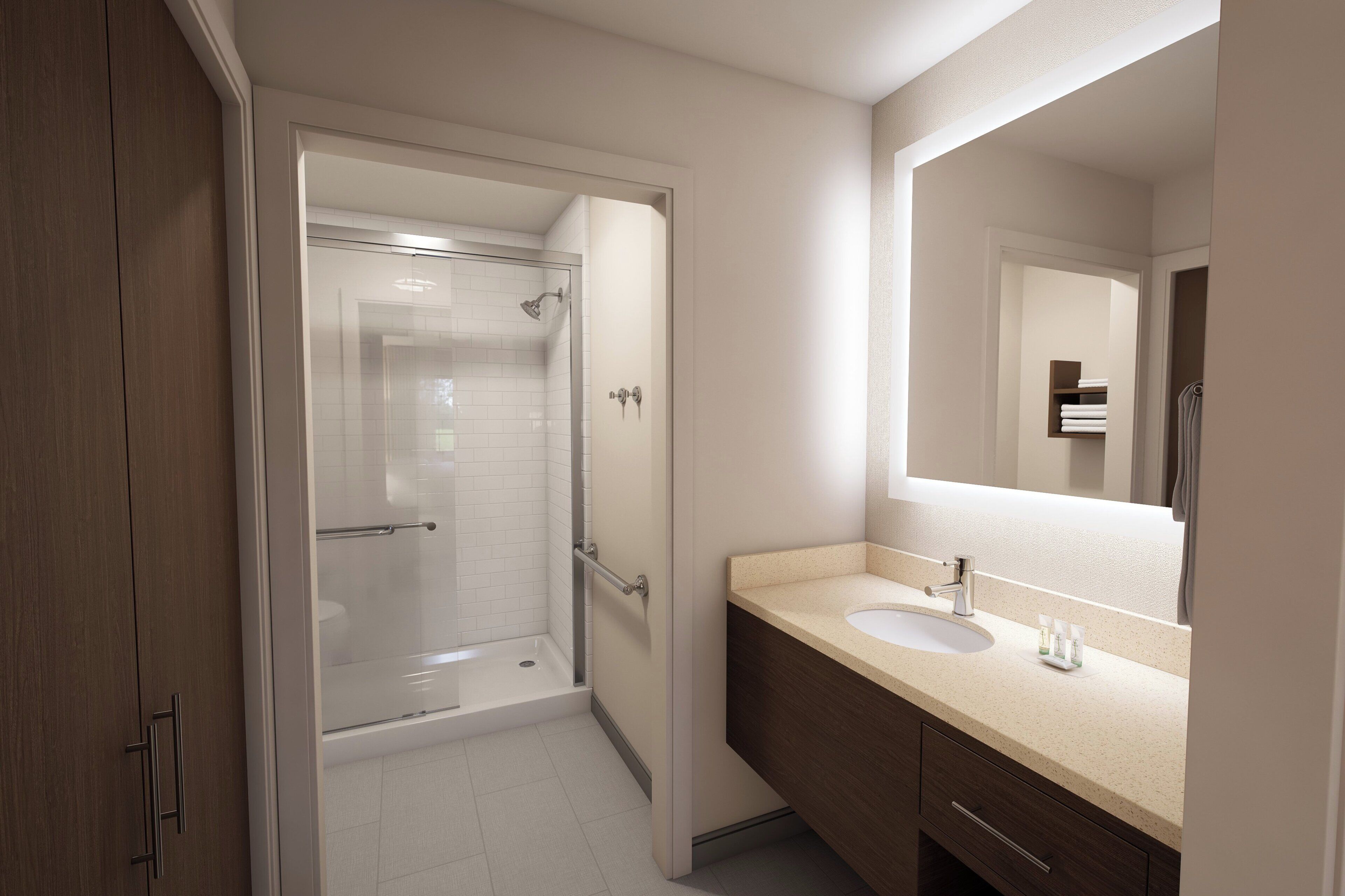 A modern bathroom with a glass-enclosed shower, a sink with a mirror, and wooden cabinetry.