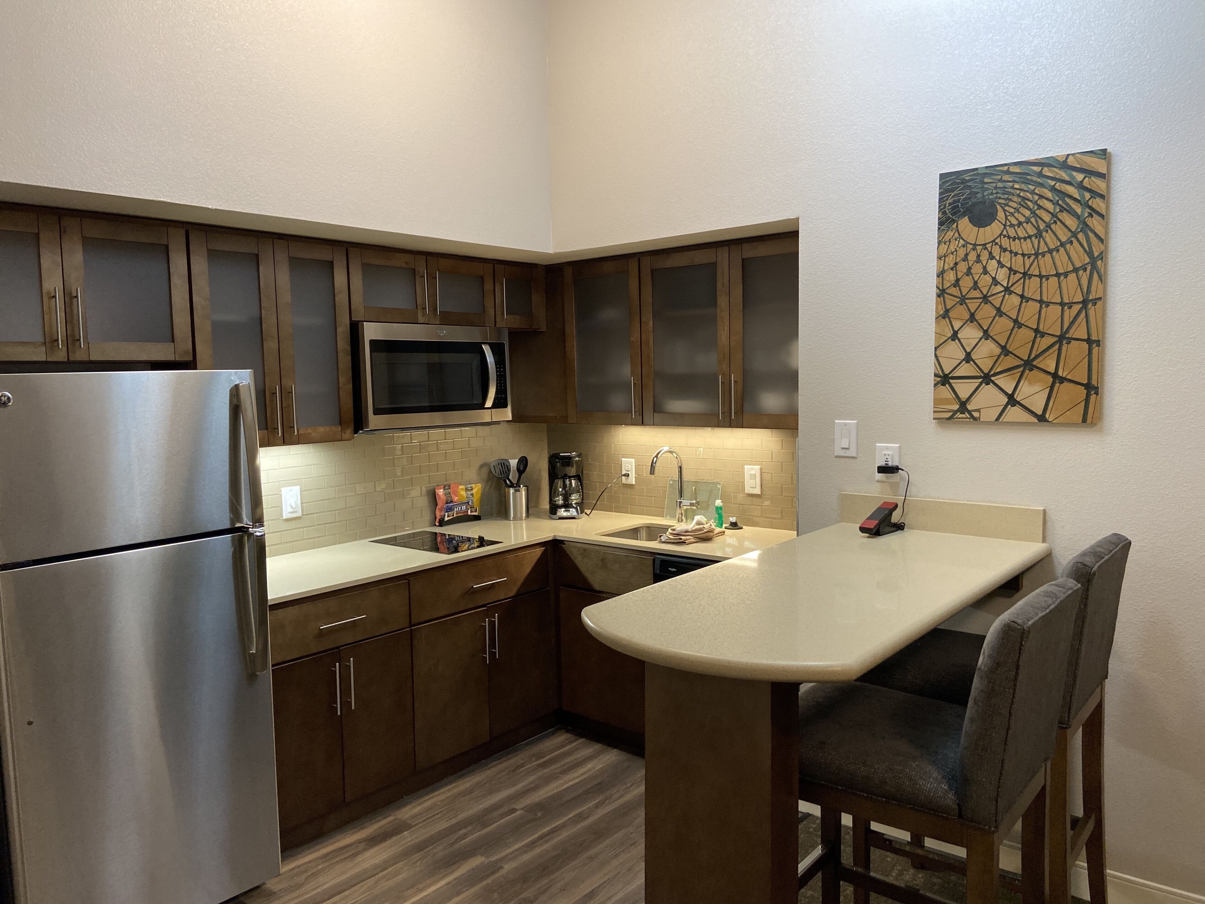 full-sized fridge, microwave, stovetop, dishwasher