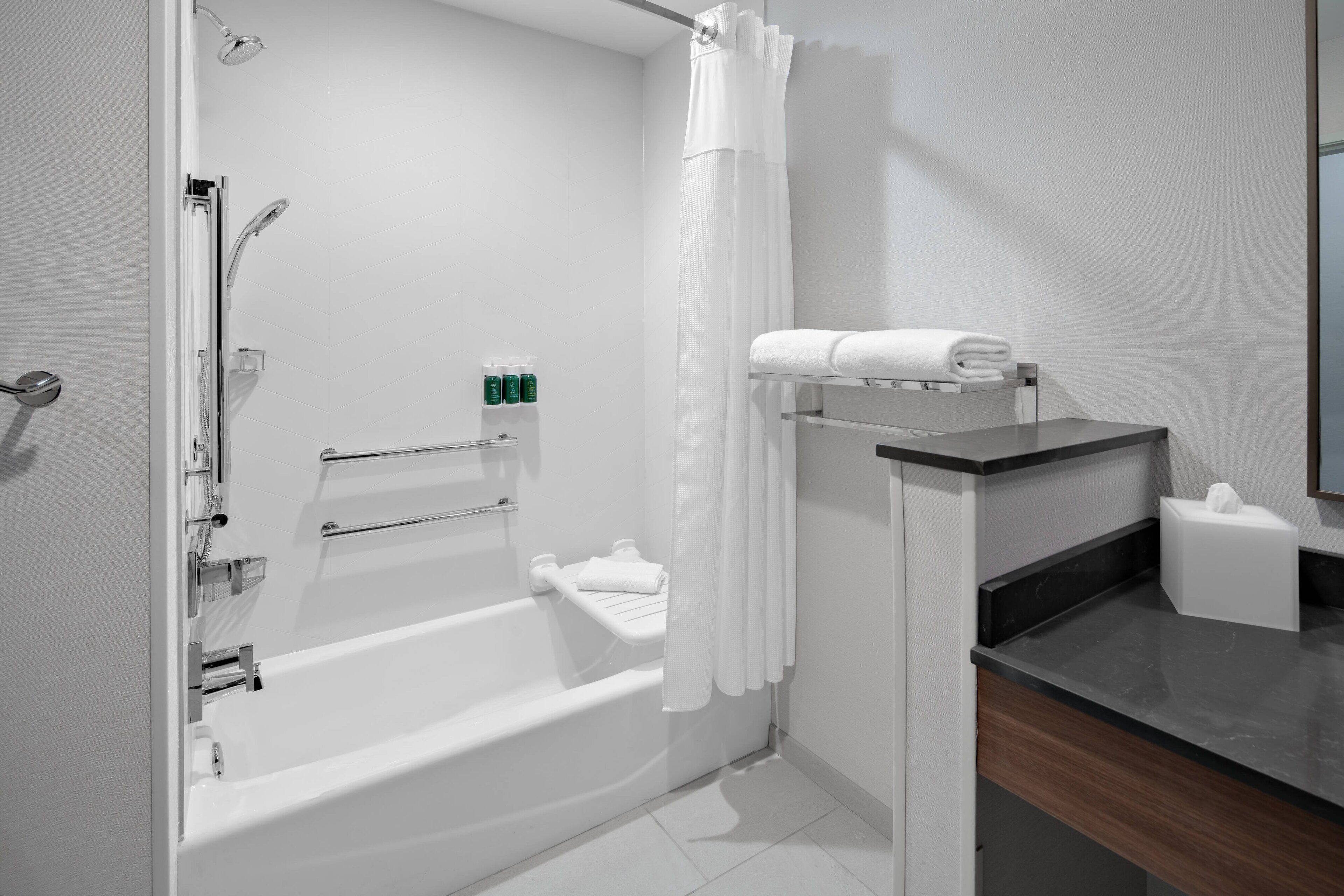 rainfall showerhead, hair dryer, towels