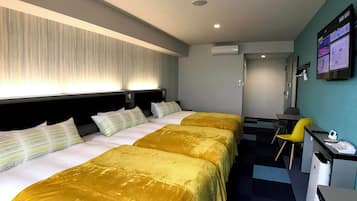 Triple Room, Non Smoking | Down comforters, desk, blackout drapes, free WiFi