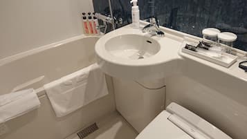 Combined shower/tub, free toiletries, hair dryer, slippers