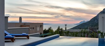 Modern holiday home with infinity pool, three bedrooms, terrace, sea view