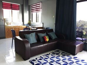 1 Bedroom Apartment | Living room | 32-inch flat-screen TV with cable channels, LED TV, Netflix - MINIMALIST Studio Apartment (Langkawi)