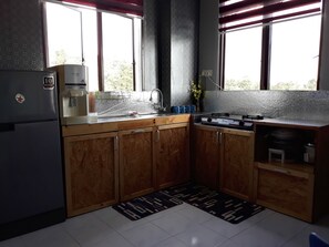 1 Bedroom Apartment | Private kitchenette | Full-size fridge, microwave, oven, stovetop - MINIMALIST Studio Apartment (Langkawi)