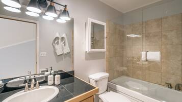 Bathtub, hair dryer, towels