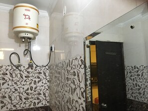 Quarto luxo | Banheiro | Chuveiro, toalhas de banho
